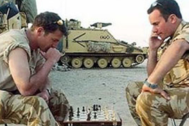 Soldier playing Chess