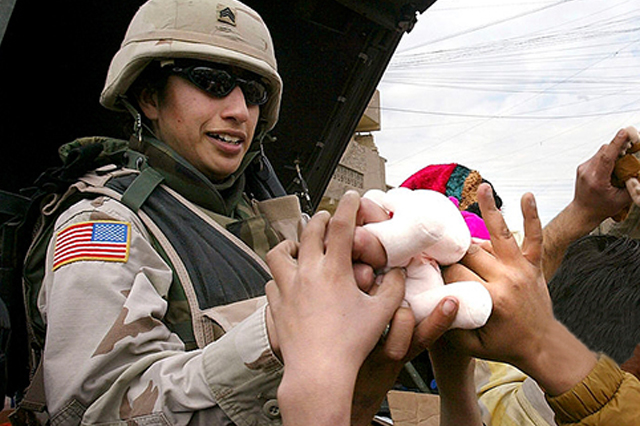 Soldier handing out toys