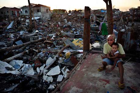 man with child after typhoon