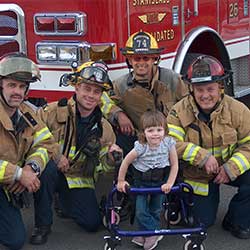 firemen with little girl